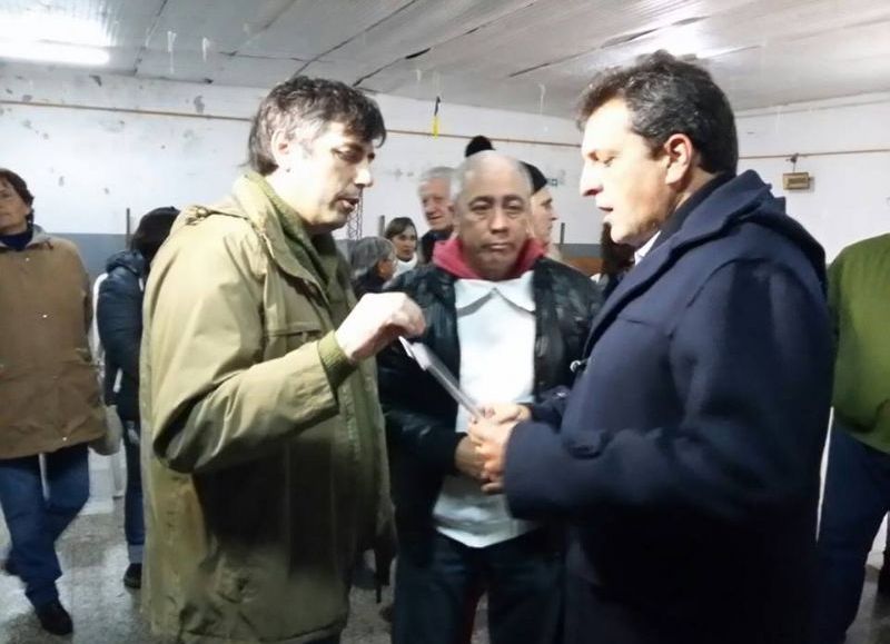 El titular de la Cámara de Comercio, Ramiro Ferrante, junto al líder del Frente Renovador, Sergio Massa.
